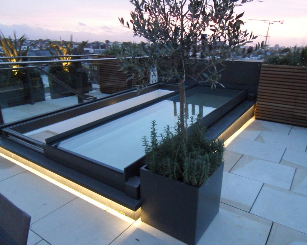 Sliding glass rooflight on a roof terrace