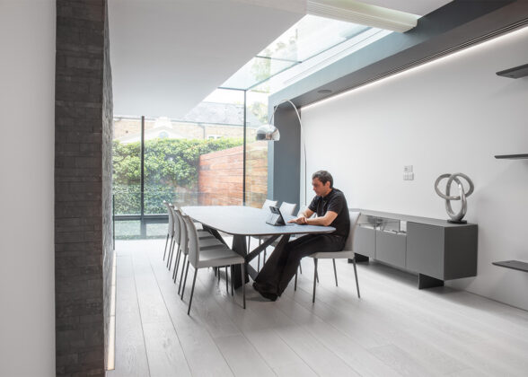 Man working in an airy. light home office