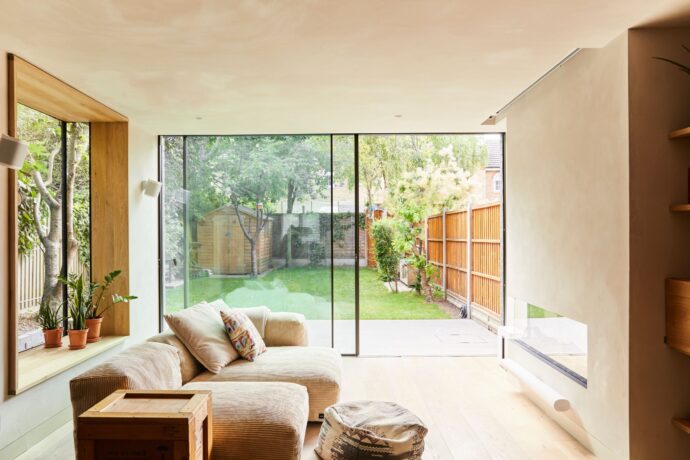 A bright sitting room enhanced by the outside world.