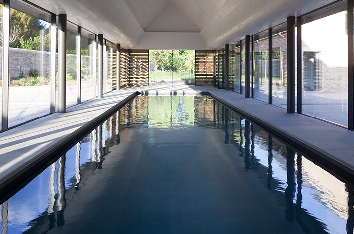 Indoor swimming pool with Sky-Frame sliding glass doors