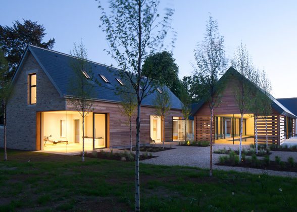 Modern farmhouse with timber panelling, Sky-Frame sliding doors and an invisible glazed corner