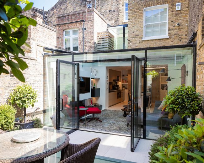 Frameless glazed extension with PureGlaze doors on the back of a terraced house