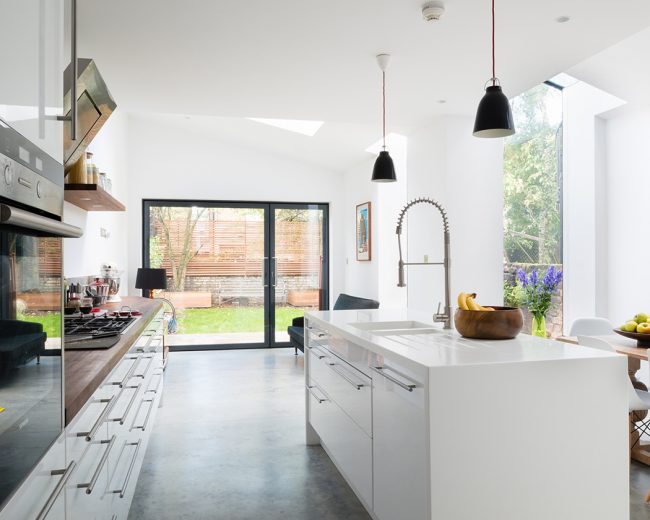 Contemporary kitchen with small frameless glass infill and PureGlaze screen and pivot door