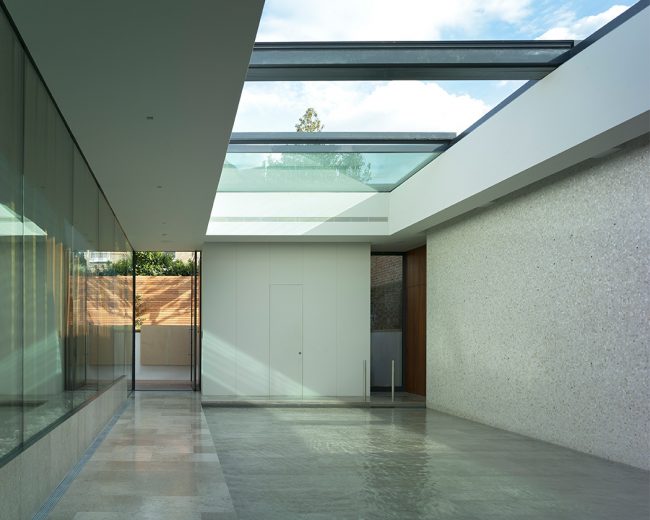 Sliding glass rooflight over a shallow indoor pool