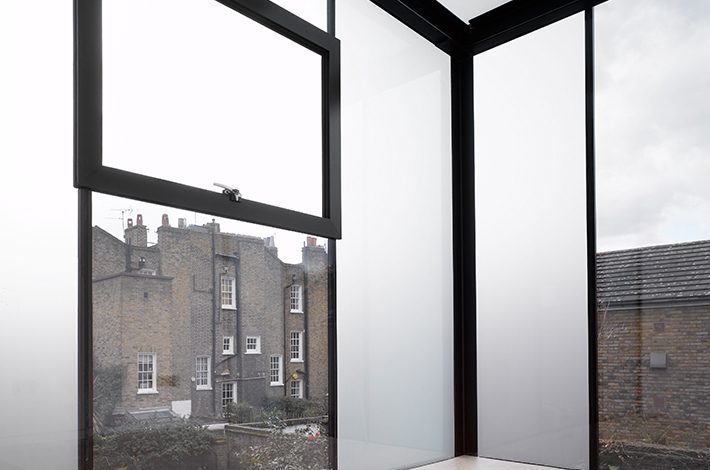 Frameless glass wall with smart glass window panels